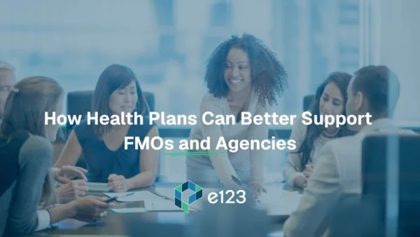 A group of professionals having a meeting in a bright office represents how Health Plans can better support FMOs and Agencies. Text over the image reads, "How Health Plans Can Better Support FMOs and Agencies." The e123 logo is at the bottom.