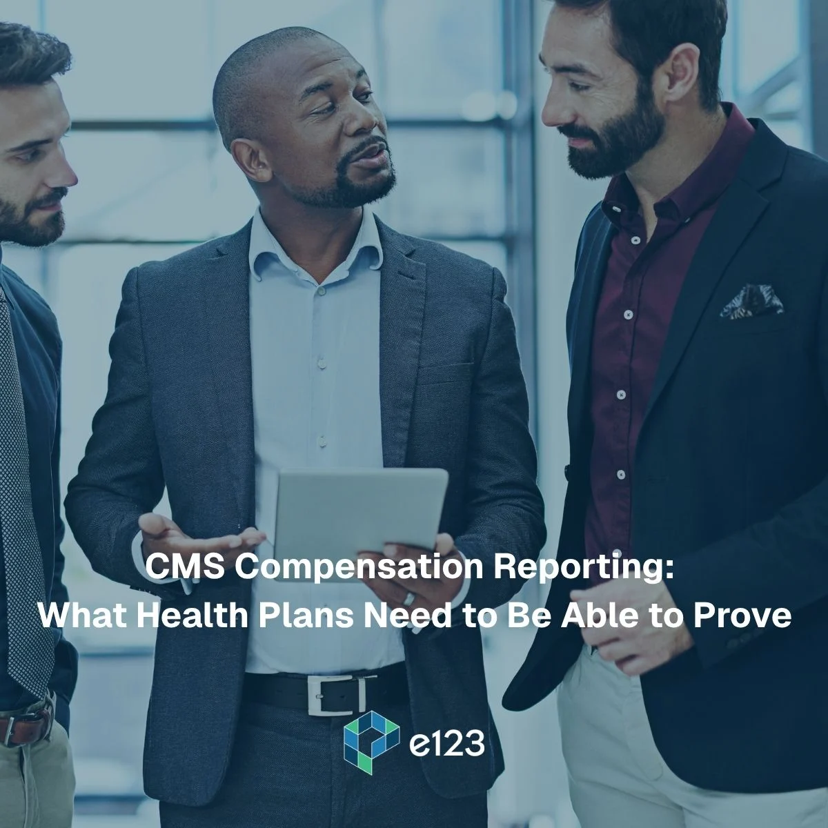 Three business professionals in suits discuss a digital tablet featuring CMS compensation reporting requirements, with overlay text and the e123 company logo.