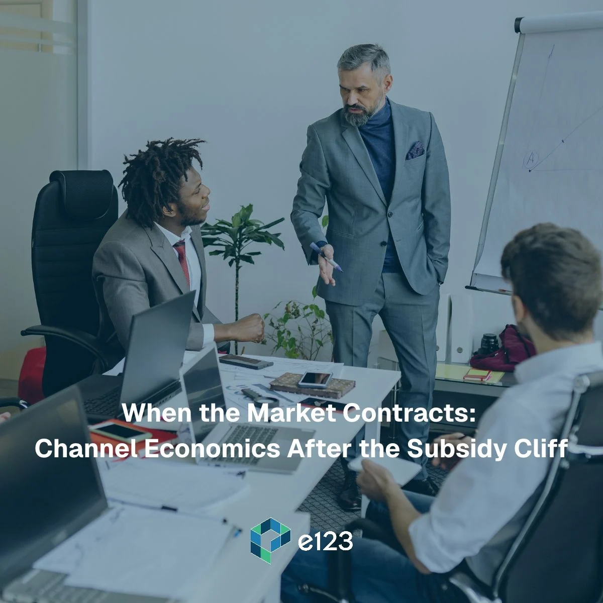 Three colleagues in a meeting around a desk, with text that reads: When the Market Contracts: Channel Economics After the Subsidy Cliff.
